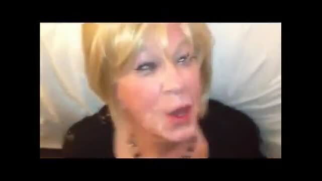 Blonde mature woman with makeup in close-up expression