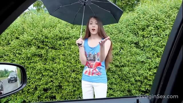 Brunette teen in blue top gives sensual car BJ outdoors