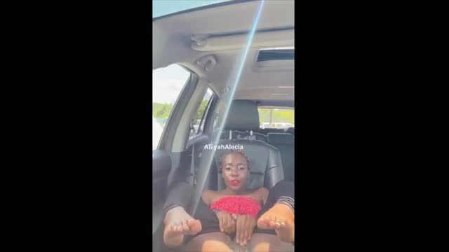 Black woman in red lace top masturbating in car