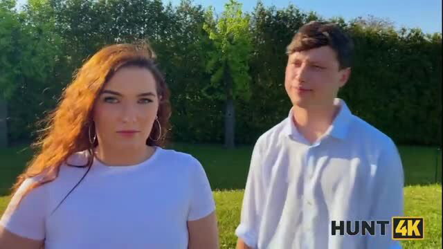 Hunt4K redhead model in white top outdoor scene
