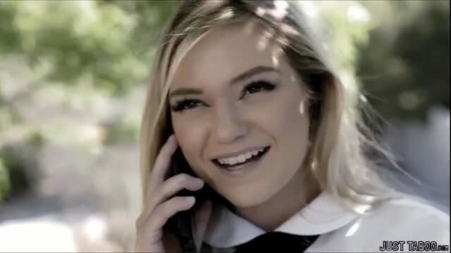 Smiling blonde teen Chloe Temple in schoolgirl outfit on phone
