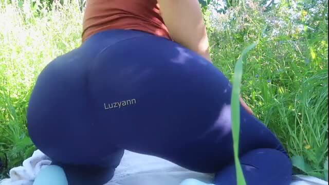 Thick woman in blue leggings outdoors, risky public tease thumbnail