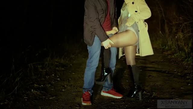Couple caught masturbating in public park at night, thigh-high boots