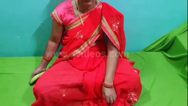 Desi bhabhi in red saree holding cucumber, outdoor sex thumbnail