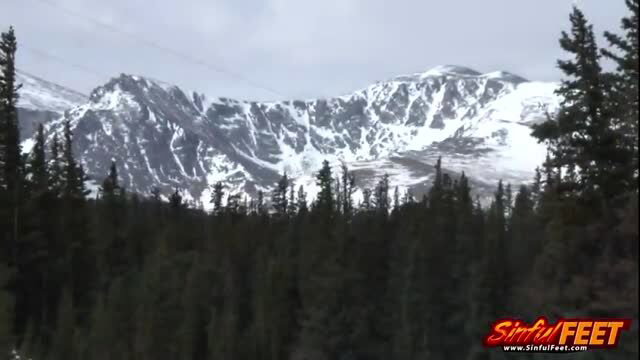 Liv Revamped nude in the Rockies mountains for outdoor adult scene