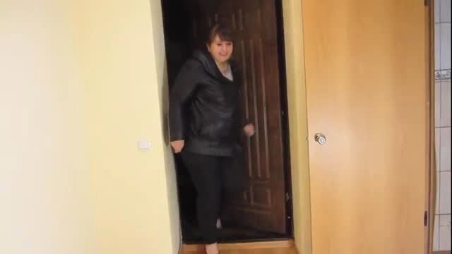 BBW in black outfit standing in doorway, amateur fetish video thumbnail