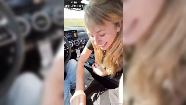Blonde amateur girl smiling in car POV, big tits hinted, OnlyFans style