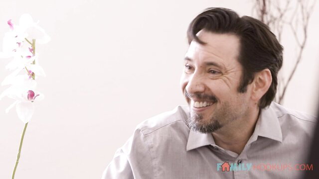 Karma Rx smiles with orchids in stepdad confrontation scene