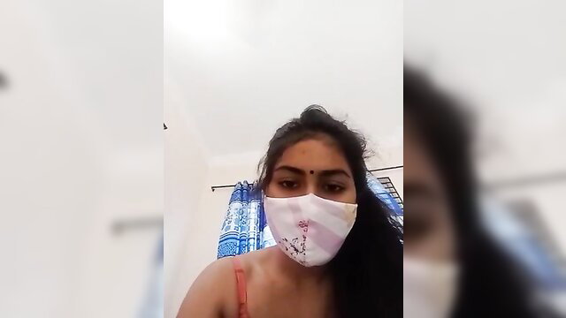 Indian beauty in tank top and mask teases pussy closeup