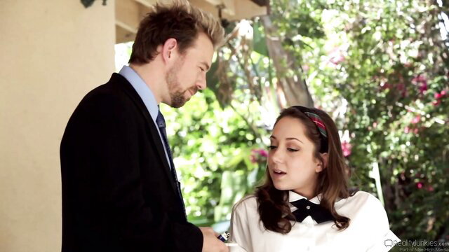 Remy LaCroix as horny college girl in uniform flirts with suited man