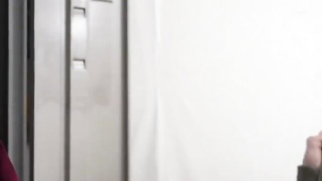 Japanese woman in red top by lockers, teasing adult JAV thumbnail