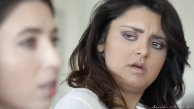 Serena Blair and Leda Lotharia bickering in kitchen, tense lesbian stares