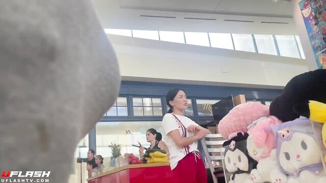 Asian girl in white shirt red pants with bulge watched in store