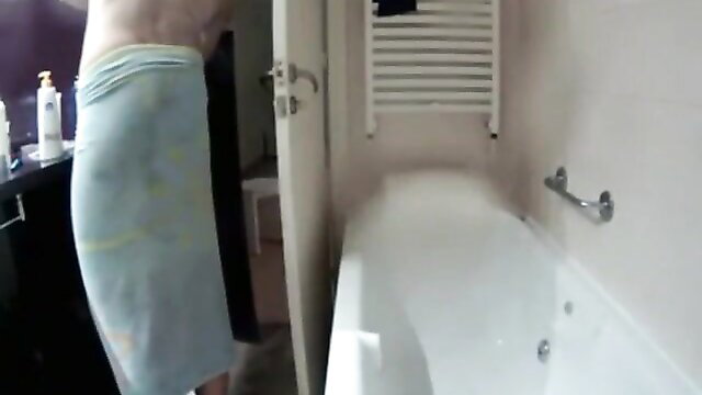 Man in towel voyeuring nude couple showering in sexy bathroom