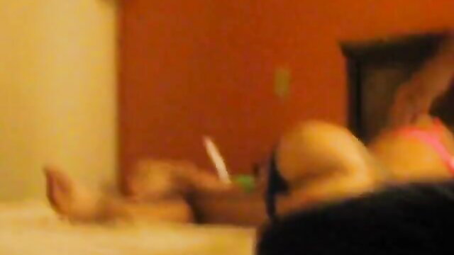 Blurry amateur solo Asian woman in pink thong on bed with toy