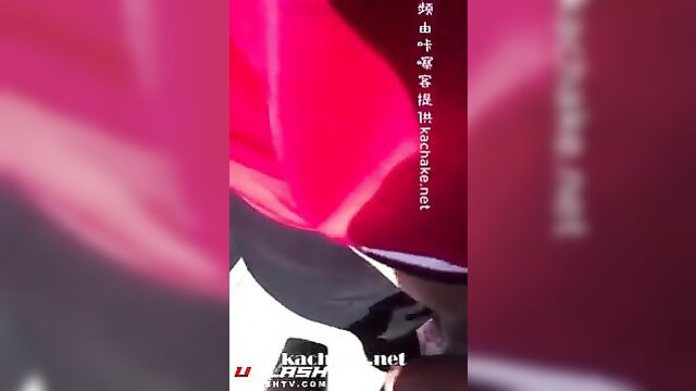 Hot Asian model in red dress posing on luxury sports car