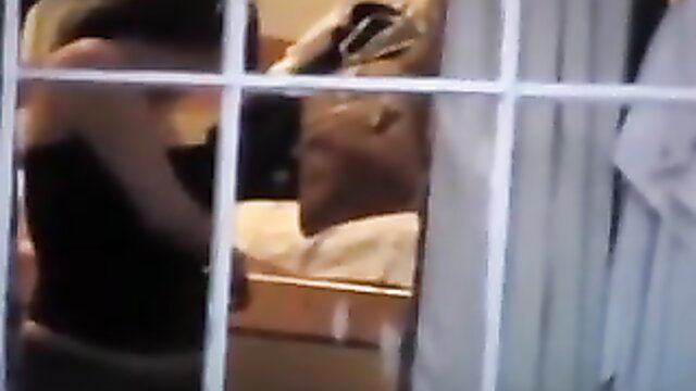 Woman spied on through window undressing in black top