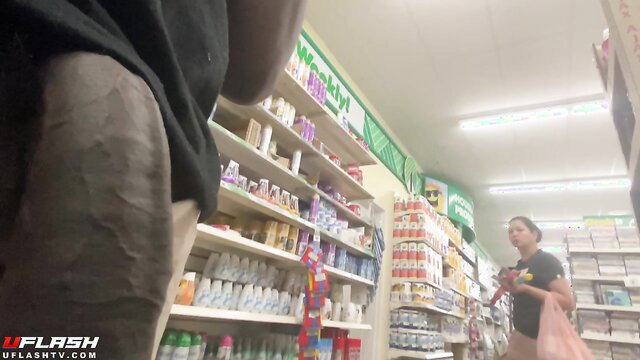 Amateur POV upskirt view of Asian woman shopping in store