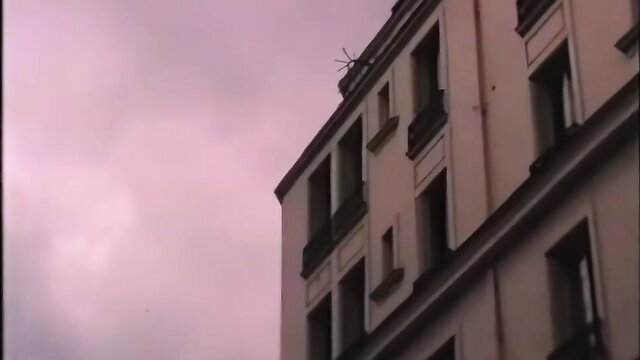 Vintage 1977 French adult film Fais-moi tout pink sunset building exterior