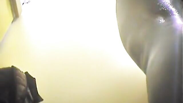 Amateur wet naked body in changing room, glistening skin closeup