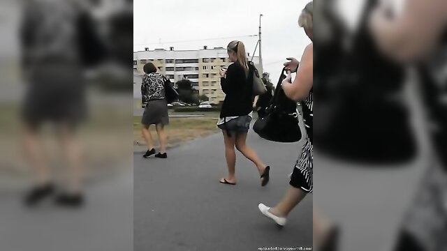 Blonde amateur schoolgirl upskirt walking in short skirt with friends