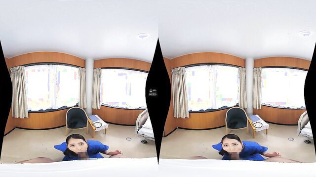 Asian woman in blue dress on floor POV in sunny room VR
