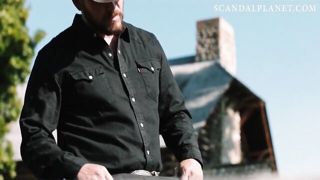 Bearded man in black denim shirt outdoors at rustic house, TV show style thumbnail