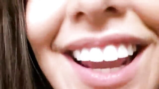 Smiling Asian woman closeup, nude smile and teeth in adult video