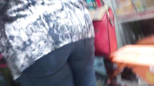 Hot Egyptian girl thick ass in tight jeans, bending over in store