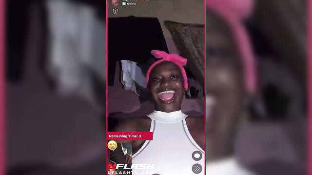 Excited black girl with pink bow smiling wide in tight top, amateur vibe