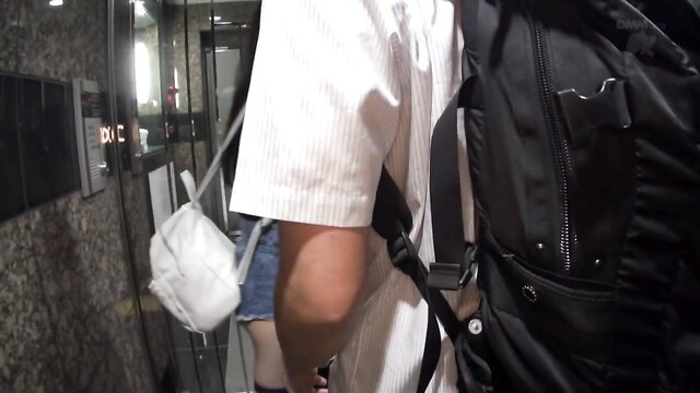 Atomi Shuri in elevator, white shirt, shorts, mask, backpack, JAV star