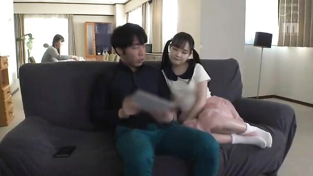Japanese loli teen in school uniform sits on boss's lap at home affair