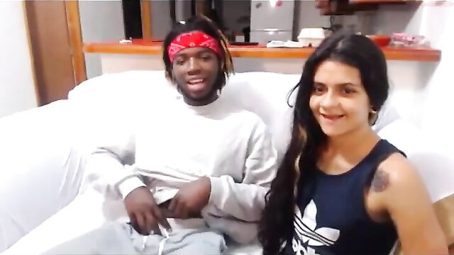 Smiling Latina with dreads man on couch in amateur thumbnail