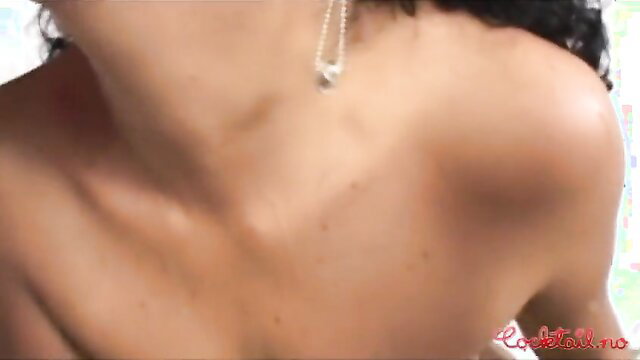 Closeup of hot brunette's neck, shoulder and big tits in adult video