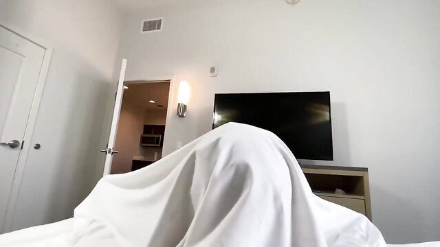 Angel Youngs under white sheets in bed, teasing sneak fuck
