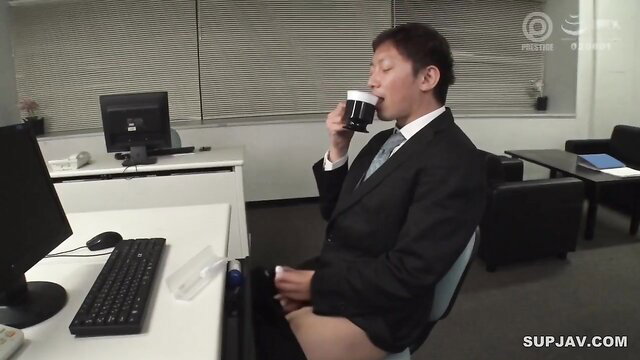 Japanese office worker drinking coffee while stroking cock under desk