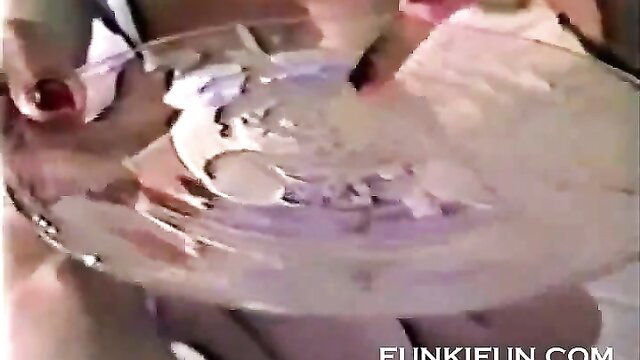 Busty woman licks semen from glass plate in hot cum eating scene