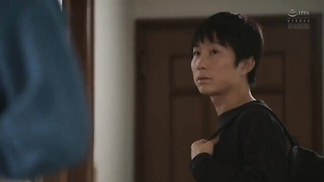 Handsome young Asian man in casual clothes, intense gaze in JAV scene