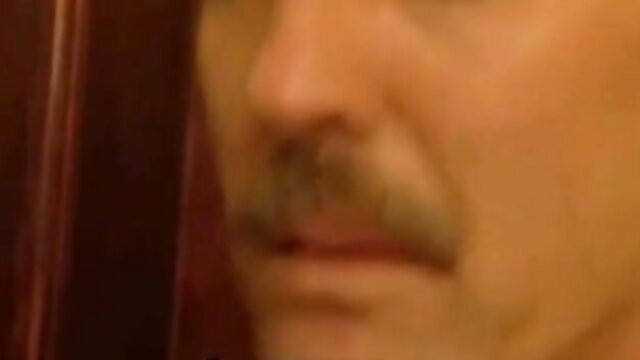 Closeup of angry mature man's mustache face in adult video thumbnail