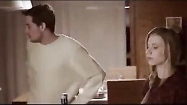 Blonde woman and man in tense kitchen encounter from hot mainstream sex movie