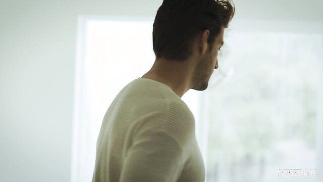 Hot shirtless man in white sweater, back view, soft lighting