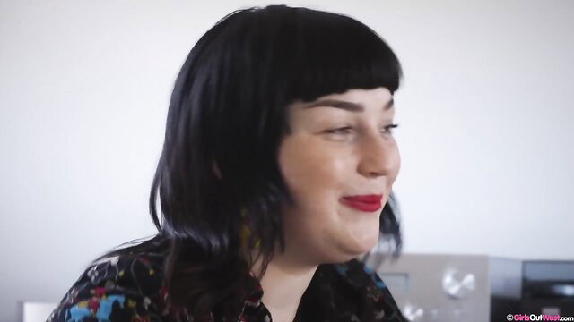 Everest and Willow closeup smiling in colorful patterned top