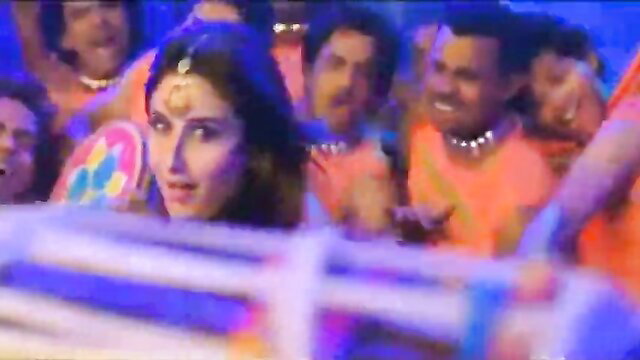 Sexy Kareena Kapoor in vibrant orange saree with bindi, dancing seductively