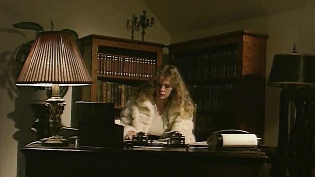 Selen in fur coat at desk in Red And Black 1995