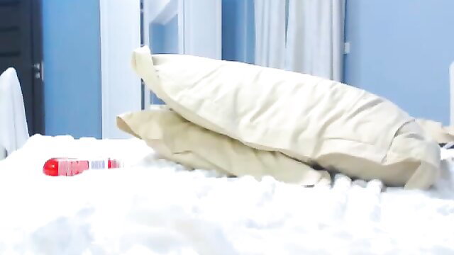 Asian smokes and masturbates on cam in bed