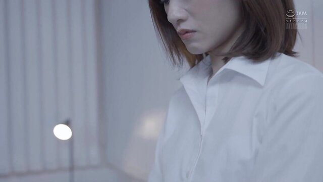 Closeup of sexy Japanese married boss in white blouse, soft lighting
