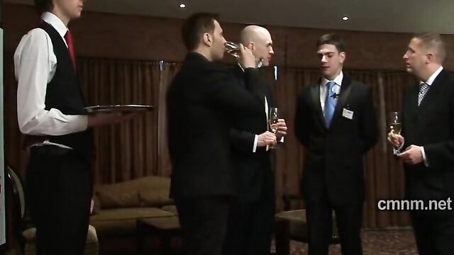Suited gay men toasting champagne at elegant event handjob tease