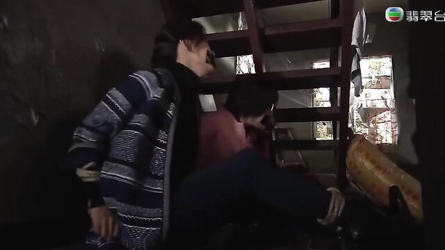 Two Asian guys in BDSM stair scene with ropes, cardigan and jeans