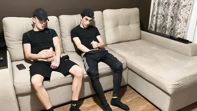 Two athletic white twinks in sportswear jerk off gay-for-pay on couch