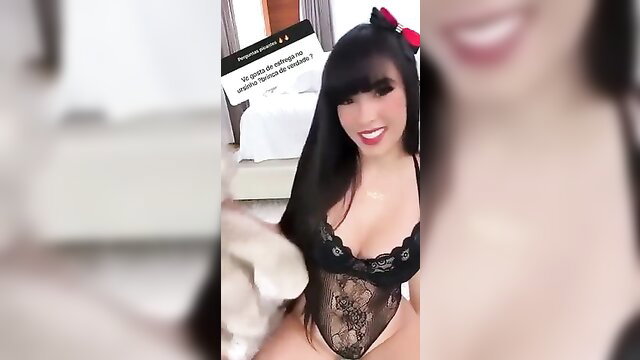 Juliana Bonde in black lingerie playing with teddy bear